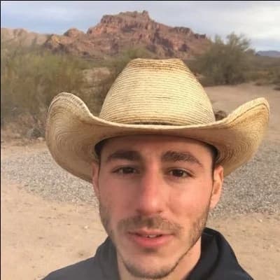 Alec in his straw cowboy hat outdoors